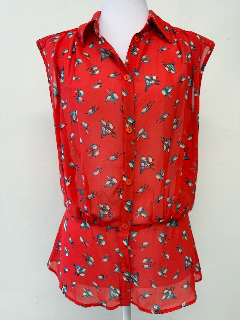 Red Sleeveless Button-Front Blouse with Blue Bird Motif